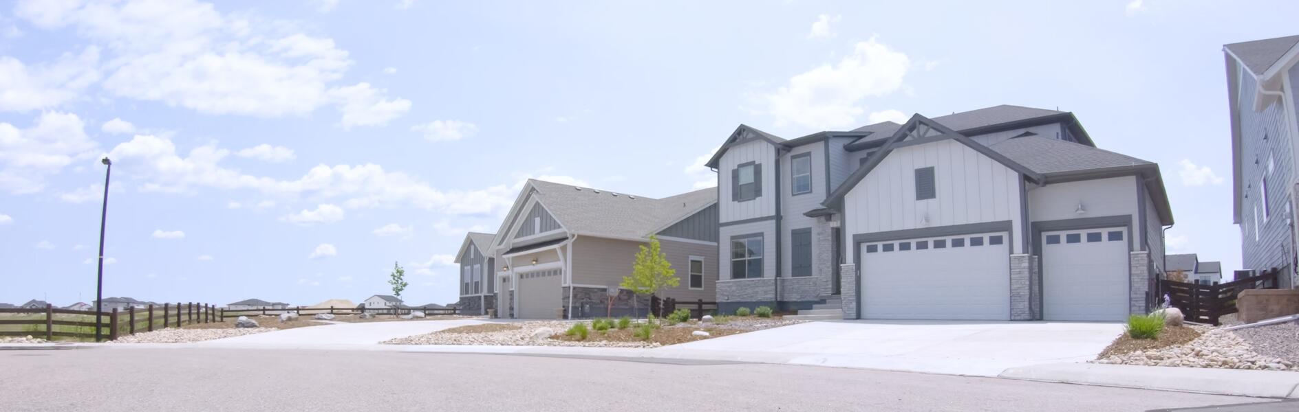 a curbside view of a home in a neighborhood